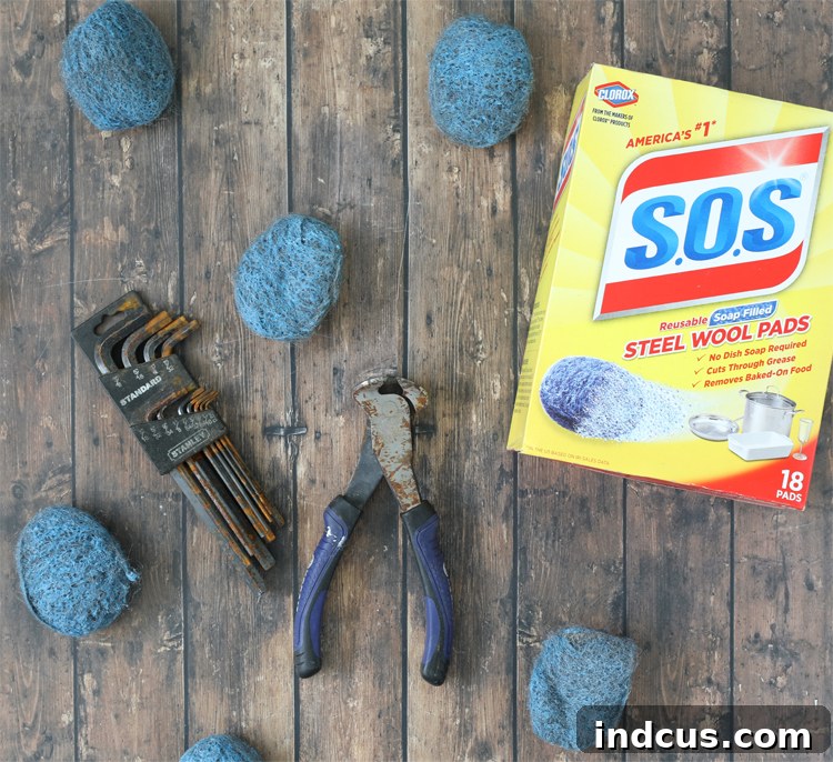 A collection of rusty metal tools, ready to be cleaned and restored.