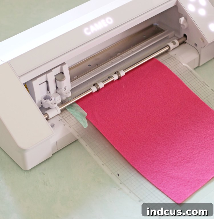 Silhouette Cameo 4 actively cutting felt with rotary blade, showing machine in action