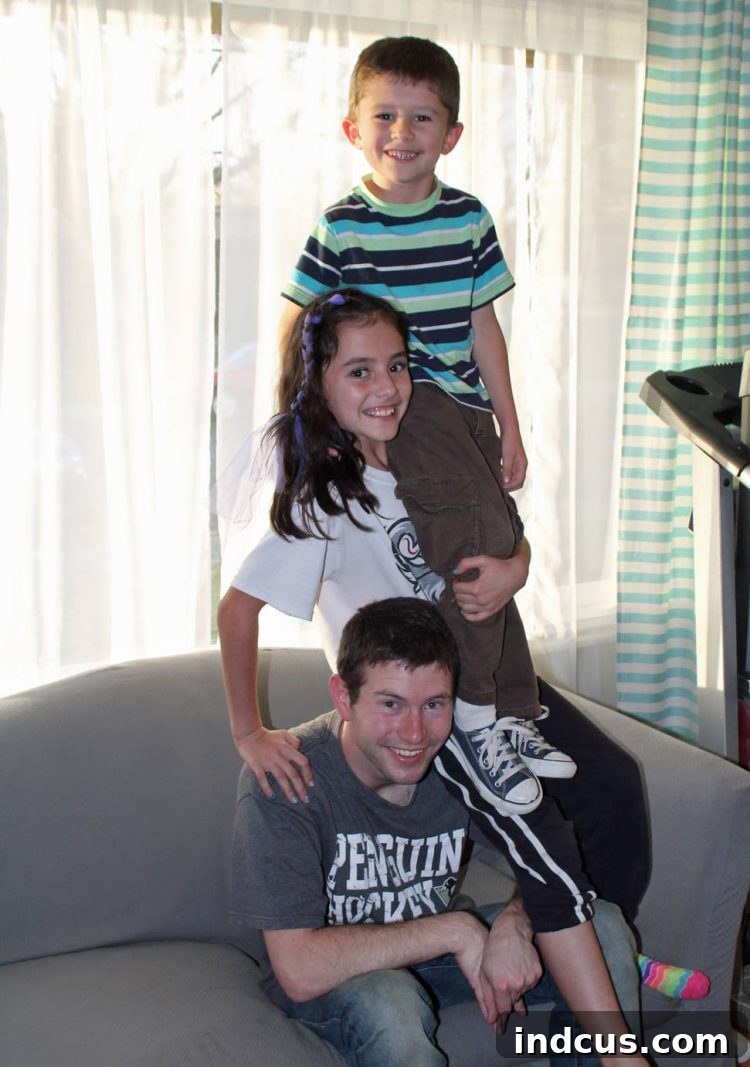 Family enjoying Studio C comedy, Shoulder Angel parody
