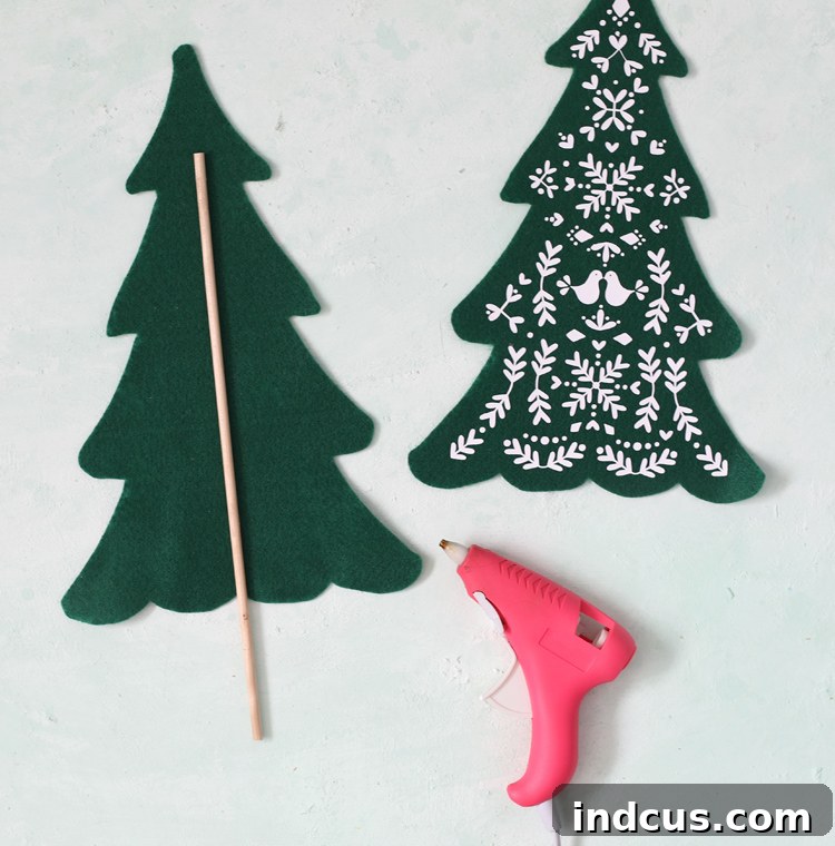 add dowel base to felt trees with hot glue