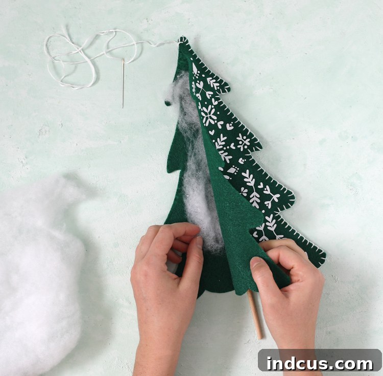 add stuffing and stitch felt trees closed with blanket stitch