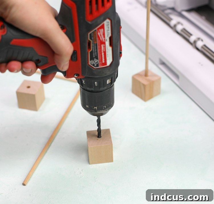 drill into wood base then insert dowel for felt tree stand