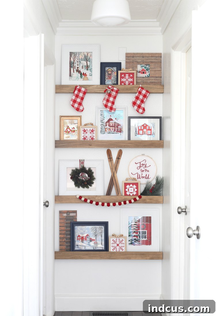 Yuletide Charm: Inside Festive Homes 19 Hallway picture ledge shelves decorated for Christmas with festive art and Scandinavian snowflakes.