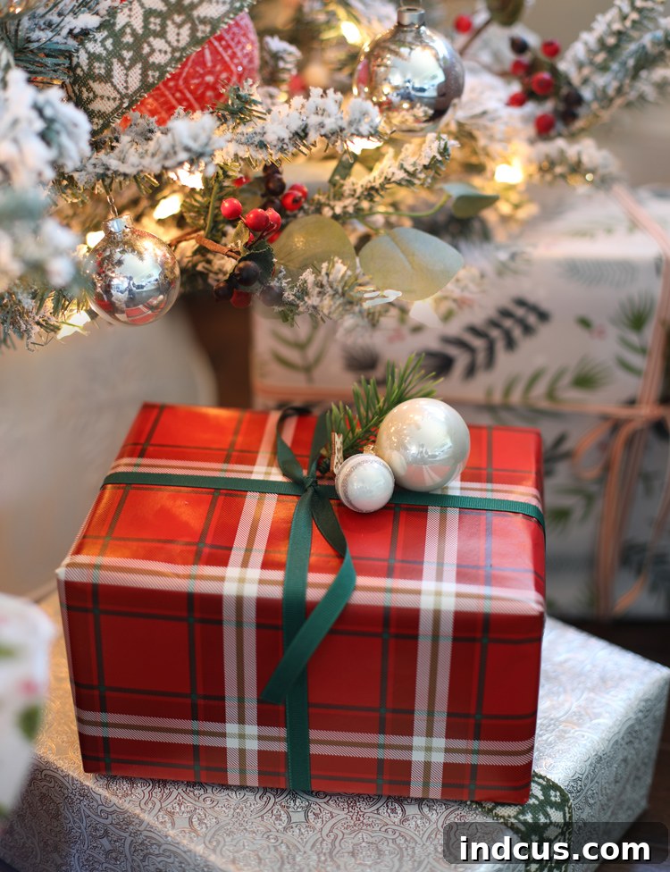 Yuletide Charm: Inside Festive Homes 7 Beautifully wrapped Christmas presents under a Christmas tree, featuring mixed patterns and textures.