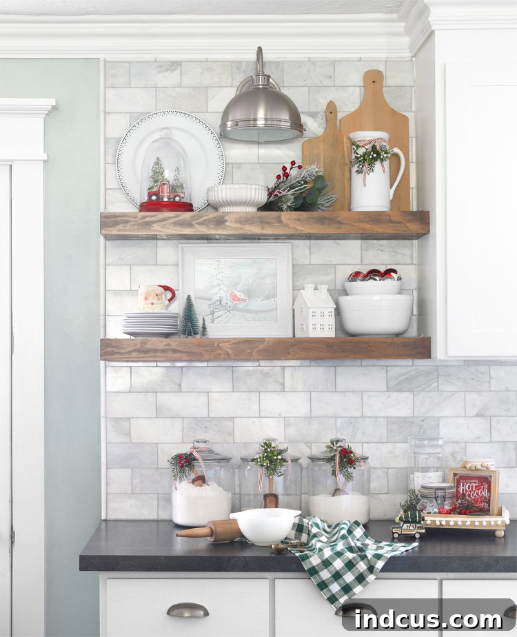 Yuletide Charm: Inside Festive Homes 8 Kitchen open shelves decorated for Christmas with red, white, and green accents and small festive touches.