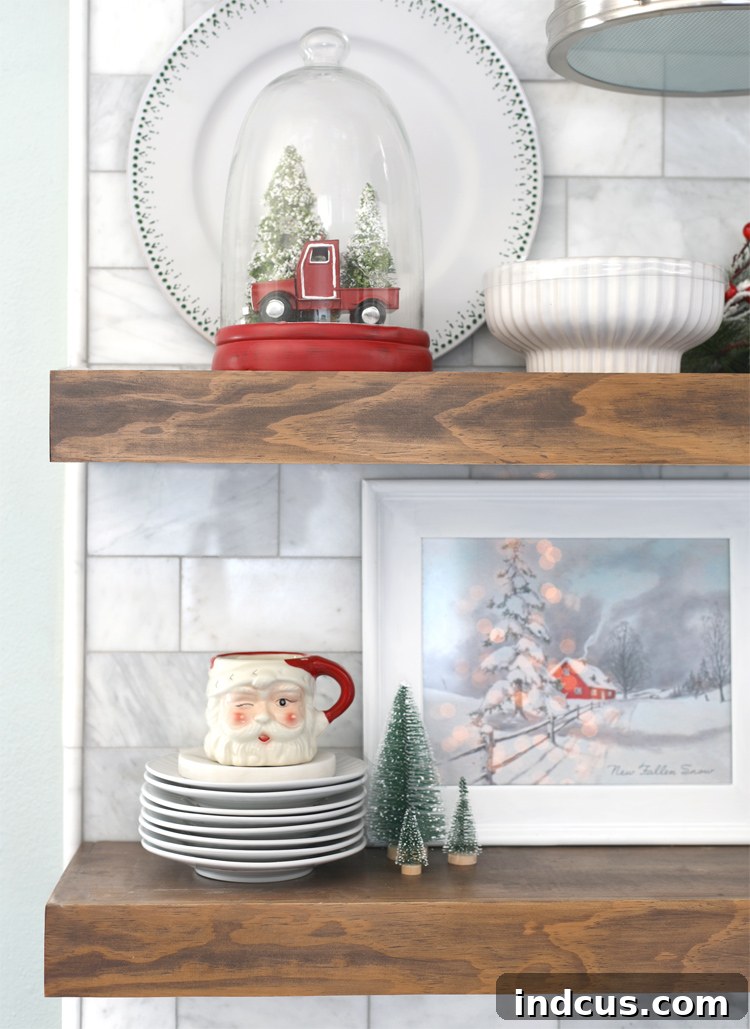 Yuletide Charm: Inside Festive Homes 9 Close-up of kitchen open shelves at Christmas, showing reflections of Christmas lights.