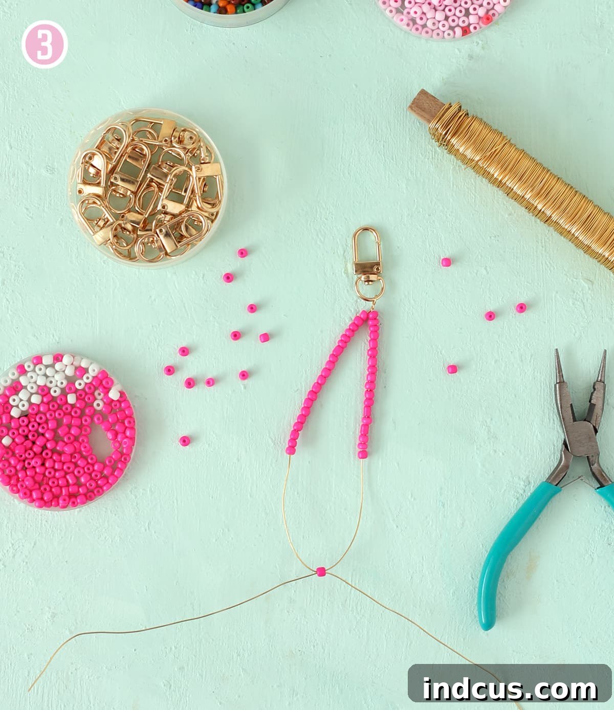 Handcraft Charming Beaded Bow Keychains 6 Crossing wires through a single bead to form a bow center