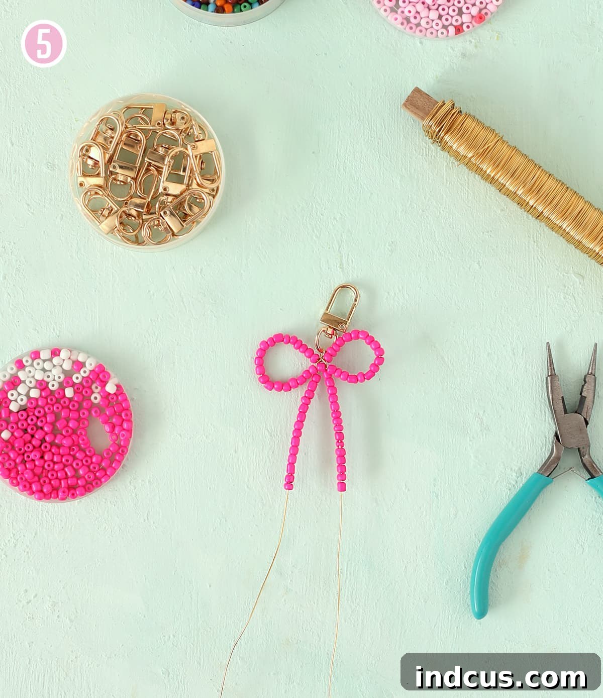 Handcraft Charming Beaded Bow Keychains 8 Adding beads to the tails of a beaded bow