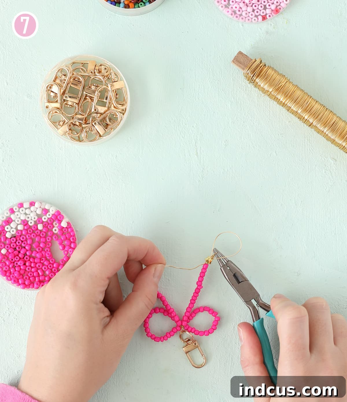 Handcraft Charming Beaded Bow Keychains 10 Tucking jewelry wire back through beads for a secure finish